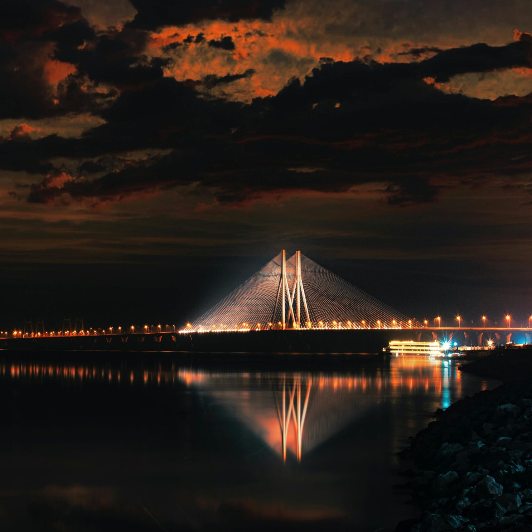 Body of Water Near Bridge during Night Time